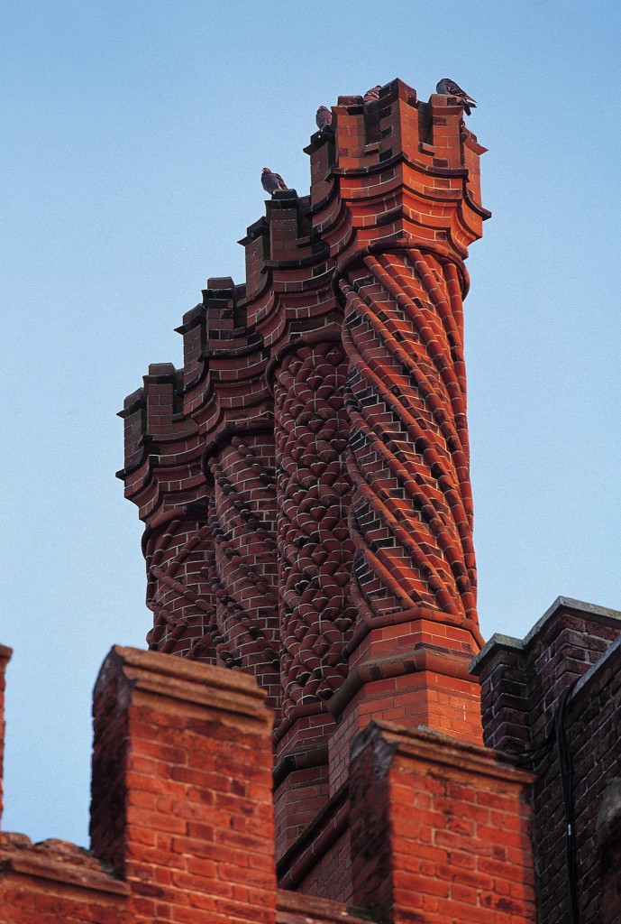 The famous Tudor 'Swizzle Stick' chimney pots stand out on the rooftops of Hampton Court Palace. Credit: Historic Royal Palaces/newsteam.co.uk